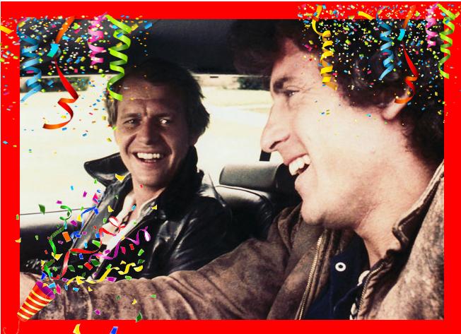 Starsky and Hutch smiling with confetti and party poppers